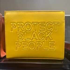 Yellow Embossed Statement Clutch